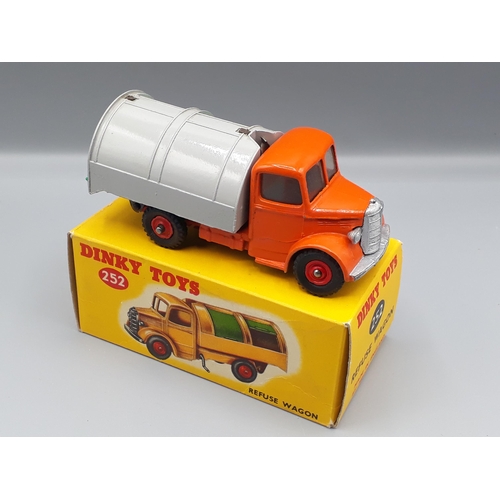 1131 - A rare boxed Dinky Toys No.252 orange and grey Refuse Wagon with red plastic hubs, both superb