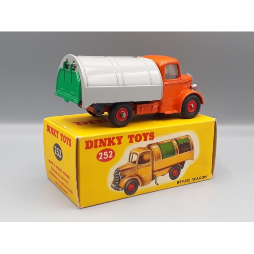 1131 - A rare boxed Dinky Toys No.252 orange and grey Refuse Wagon with red plastic hubs, both superb