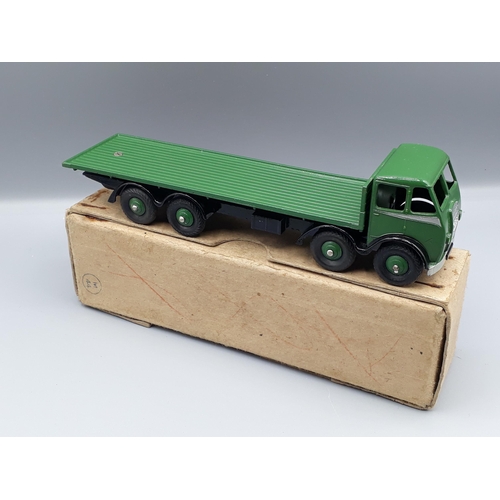 1162 - A boxed Dinky Supertoys No.502 1st type Foden Flat Truck with green cab and back and black chassis, ... 