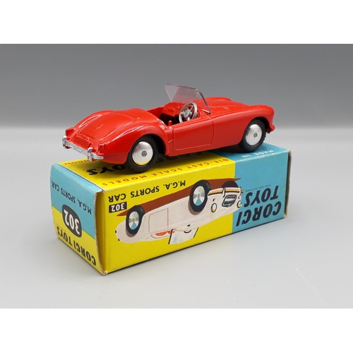 1171 - A boxed Corgi Toys No.302 red M.G.A. Sports Car in yellow and blue box, Nr M-M, box superb