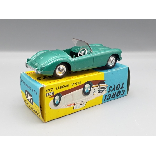 1172 - A boxed Corgi Toys No.302 metallic green M.G.A. Sports Car with dished hubs, Nr M-M, box superb