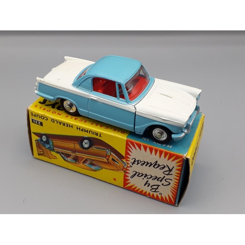 1202 - A boxed Corgi Toys No.231 white and blue Triumph Herald Coupe, Nr M-M, box E+