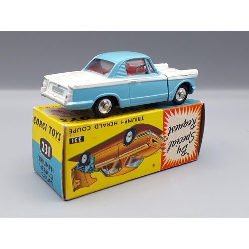 1202 - A boxed Corgi Toys No.231 white and blue Triumph Herald Coupe, Nr M-M, box E+