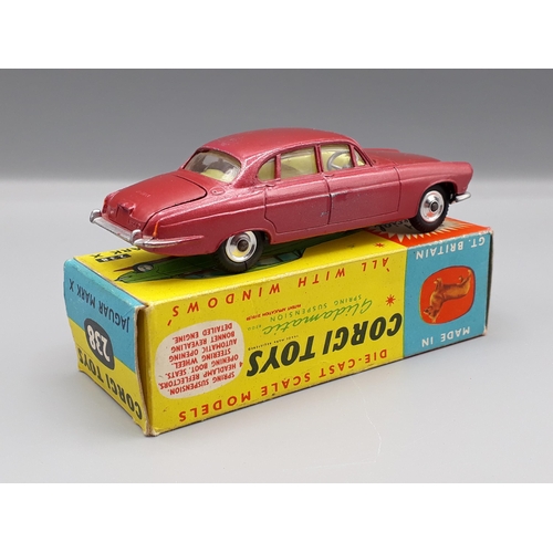 1263 - A boxed Corgi Toys No.238 red Jaguar Mark X