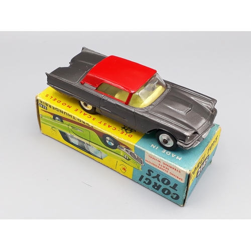 1268 - A boxed Corgi Toys No.214s dark grey and red Ford Thunderbird (biro marks on box)