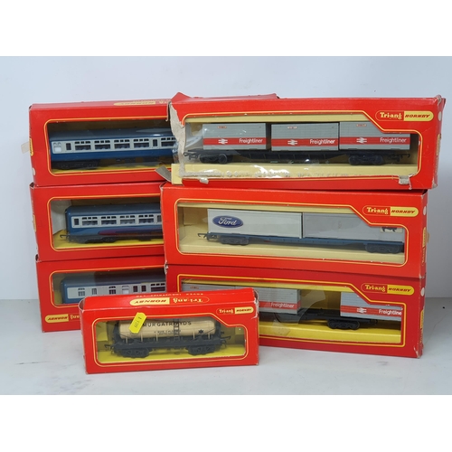 1301 - Three boxed Triang Hornby Intercity Coaches, two Wagons, a boxed R.459A Large Station Set and a Tran... 