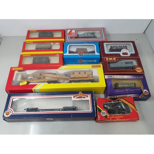 1306 - Thirty boxed Hornby, Bachmann and Dapol 00 gauge Wagons, a Hornby Rail Freight Set and a quantity of... 