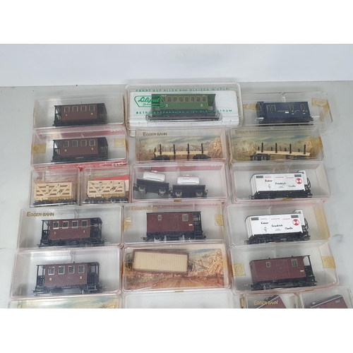 1313 - Two boxes of mainly boxed Jouef Egger-Bahn H0e Coaches and Wagons and various H0e and N gauge Track