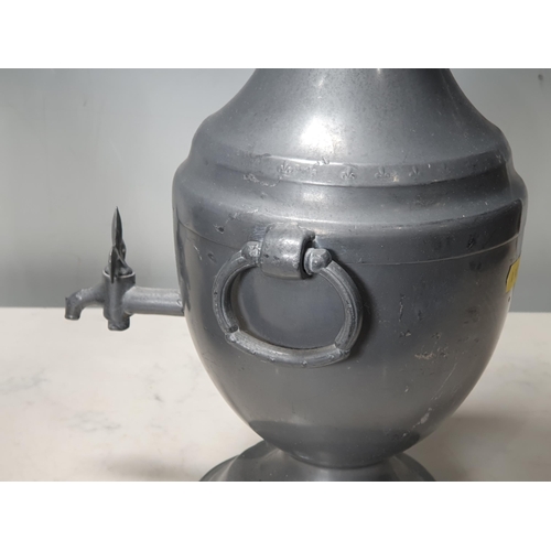 1 - A tall pewter Water Jug with acorn finials and bow shaped handle, 1ft 5