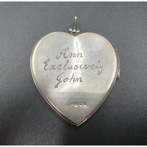 109 - An Elizabeth II silver heart shaped Locket with floral engraving, London 1968, and two sterling silv... 