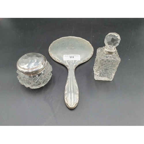 111 - A silver mounted Dressing Mirror, Scent Bottle and Jar