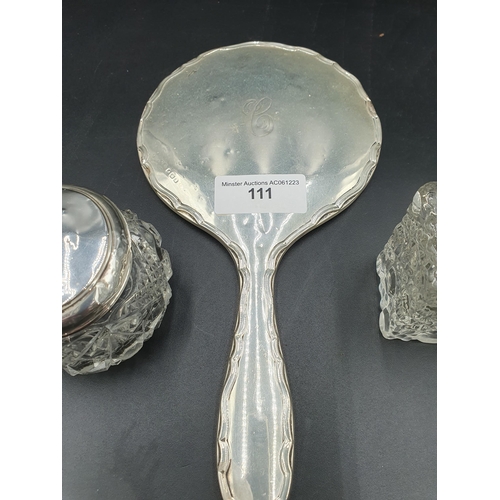 111 - A silver mounted Dressing Mirror, Scent Bottle and Jar