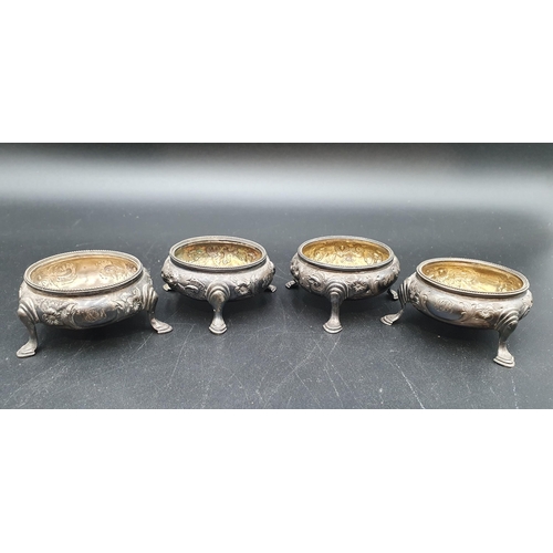 121 - Two pairs of Victorian silver Cauldron Salts floral embossed on hoof feet, London 1862/3