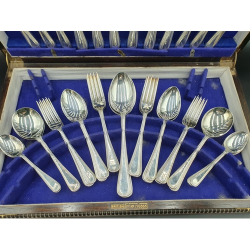 122 - A Canteen of plated Cutlery, bead pattern for six, in oak case