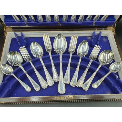 122 - A Canteen of plated Cutlery, bead pattern for six, in oak case