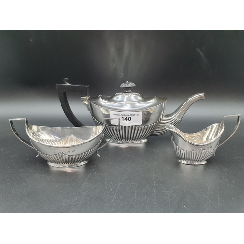 140 - A Victorian silver Bachelor's Three Piece Tea Service of oval semi fluted form, Birmingham 1896, 300... 