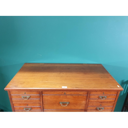 15 - A walnut Chest of Drawers with central Top Hat drawer flanked by short drawers above two long drawer... 