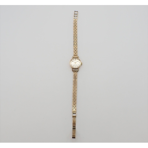 156 - A lady's Omega Wristwatch the silvered dial with hourly baton markers in 9ct gold case, case width a... 