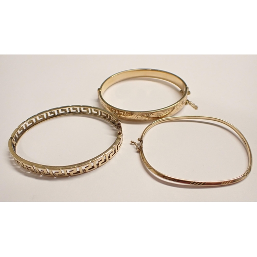 157 - A 14ct gold Greek key design hinged Bangle, approx 14gms, a narrow gold Bangle marked 9kt, approx 3.... 