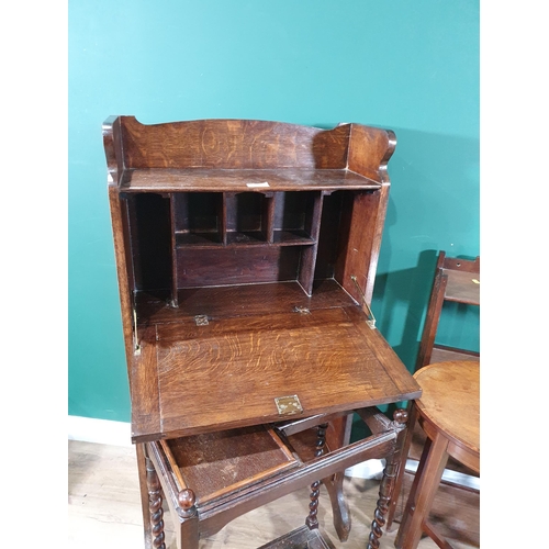 16 - An oak Bookcase with fall front enclosing pigeon holes, 4ft High x 2ft Wide, a mahogany oval Occasio... 