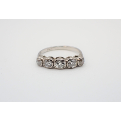 162 - A Diamond five stone ring rubover-set graduated old-cut stones, stamped PLAT, ring size N 1/2