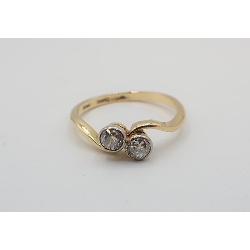 169 - A Diamond two stone crossover Ring set old-cut stones in 18ct gold, ring size N 1/2, approx 2.60gms