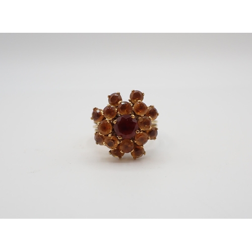 175 - A Citrine Flower Cluster Ring peg-set round stones, stamped 18K, ring size K-L, approx 7.60gms