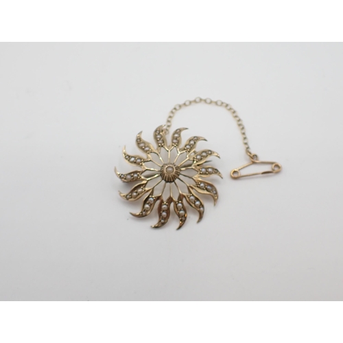 181 - A 9ct gold openwork Flowerhead Brooch set seed pearls, 30mm diameter, approx 3.85gms