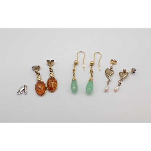 202 - A pair of Jade drop Earrings, a pair of modern pressed Amber drop Earrings in 9ct gold and a pair of... 