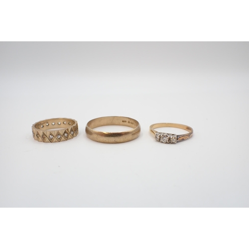 205 - A Diamond three stone Ring claw-set graduated brilliant-cut stones, stamped 18ct and two 9ct gold We... 