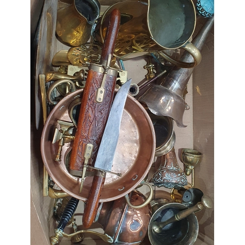 335 - A box of assorted Metalware including, large brass Jug, a copper two handled Pan, two brass Trivets,... 