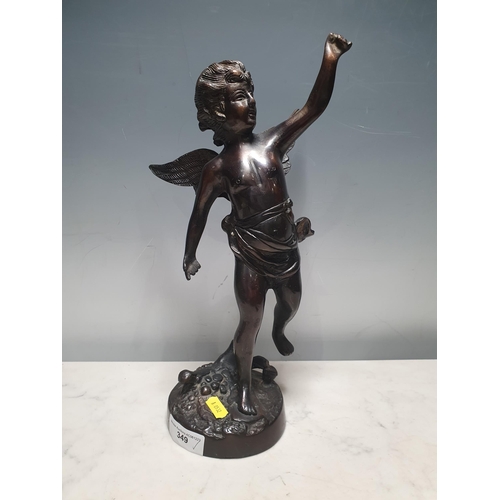 349 - A bronze Statue of a winged Cherub raised on circular base, unsigned, 1ft 2