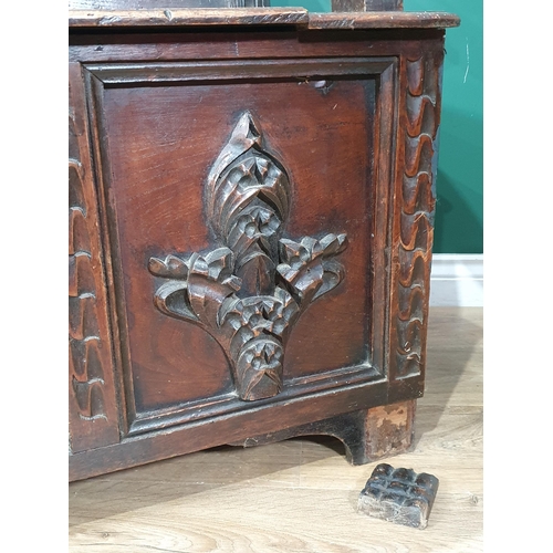 474 - An oak Box Settle with carved panel back, lift up seat, above three panel front with carved applied ... 