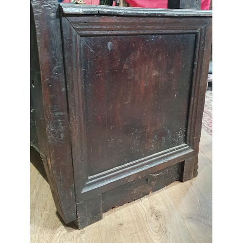 474 - An oak Box Settle with carved panel back, lift up seat, above three panel front with carved applied ... 