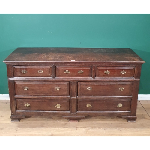 484 - An antique oak Lancashire Chest fitted three short drawers above four long drawers raised on bracket... 