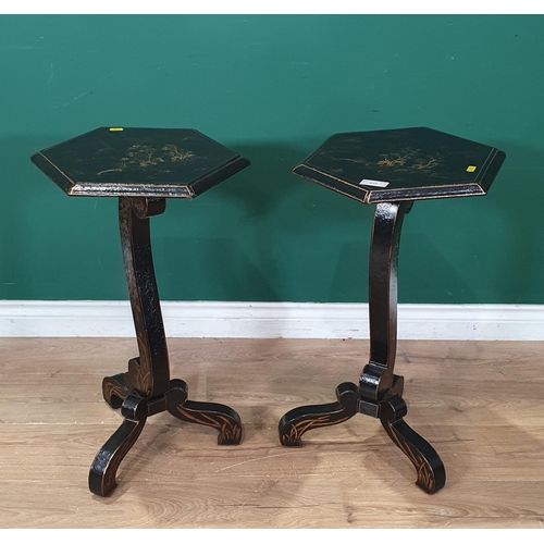 486 - A pair of black laquered Chinoiserie hexagonal topped Occasional Tables on shaped supports and tripo... 