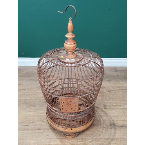 495 - A decorative Oriental Hanging bamboo Birdcage with carved door and three carved supports, 2ft 6