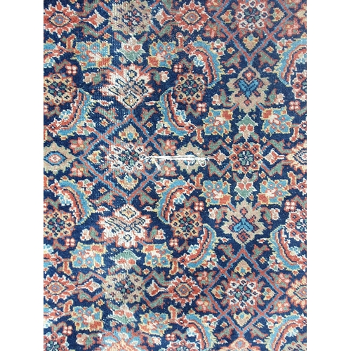 499 - A Persian style Carpet with multi borders with all over floral motif designs, A/F, faded and some re... 