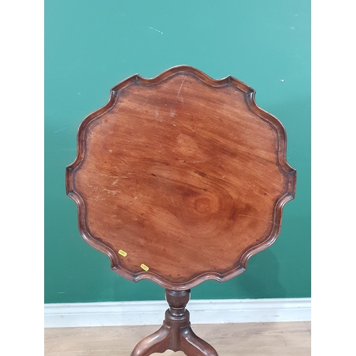 525 - A mahogany tilt top Occasional Table, with pie crust top on bird cage, with turned column on splayed... 