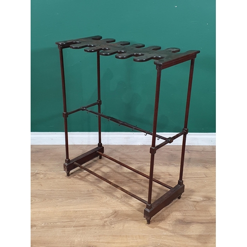 529 - A mahogany Boot and Whip Rack on turned supports united by double stretchers, raised on turned bun f... 