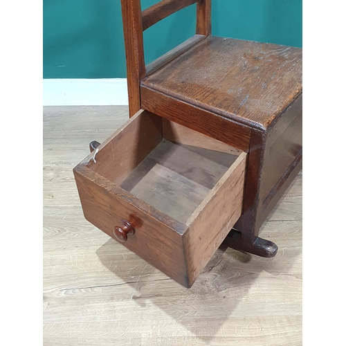 538 - An oak bar back Rocking Lambing type Chair with single fitted drawer, 2ft 9