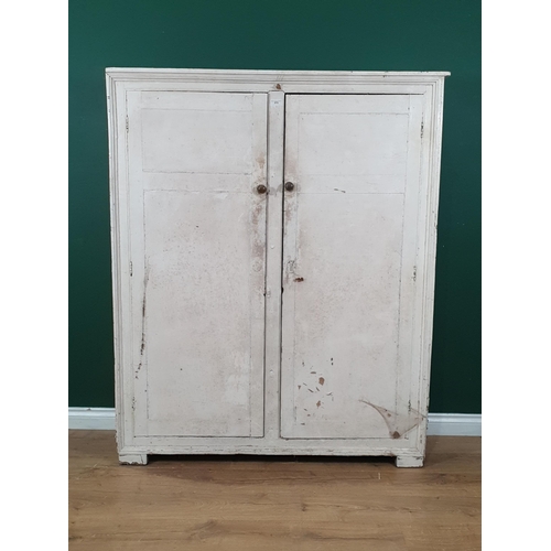 572 - A white painted two door Cupboard with moulded frame, the doors enclosing fitted shelves, 5ft 2