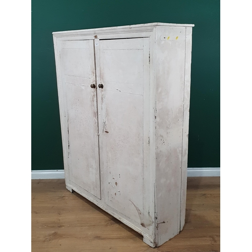 572 - A white painted two door Cupboard with moulded frame, the doors enclosing fitted shelves, 5ft 2