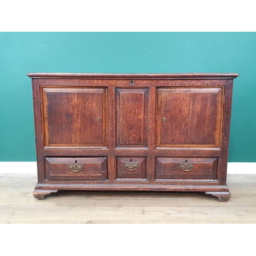 578 - An antique oak Mule Chest, the lift up lid above panelled front that's converted to pair of cupboard... 