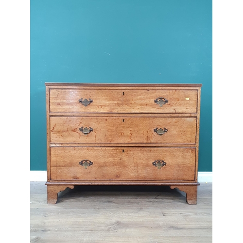 579 - An oak Chest of three long graduated Drawers raised on bracket feet, 3ft High x 3ft 9