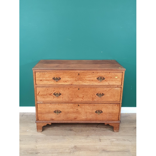 579 - An oak Chest of three long graduated Drawers raised on bracket feet, 3ft High x 3ft 9