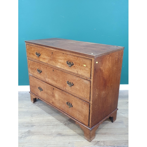 579 - An oak Chest of three long graduated Drawers raised on bracket feet, 3ft High x 3ft 9