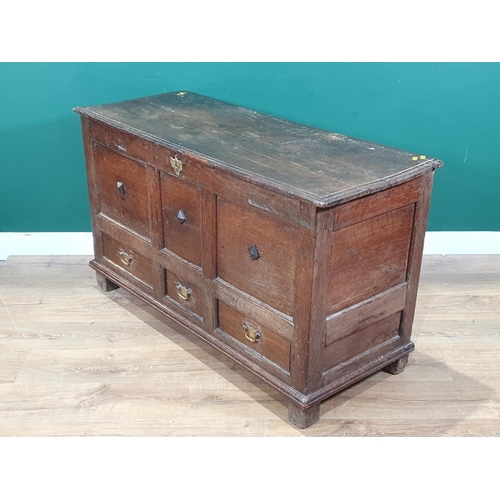 582 - An 18th Century oak Mule Chest with three panel front above three drawers, dated and initialled 'S.M... 