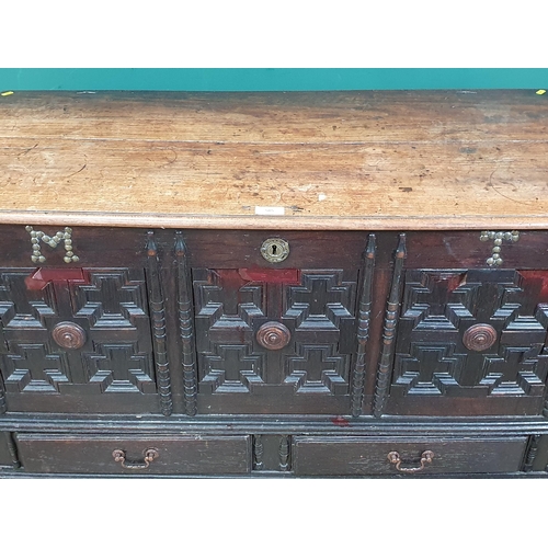 585 - An 18th Century oak Mule Chest, with carved and applied geometric designs, with the initials 