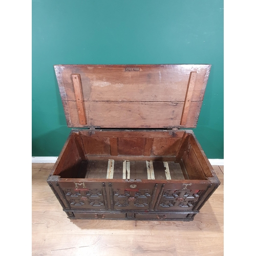 585 - An 18th Century oak Mule Chest, with carved and applied geometric designs, with the initials 